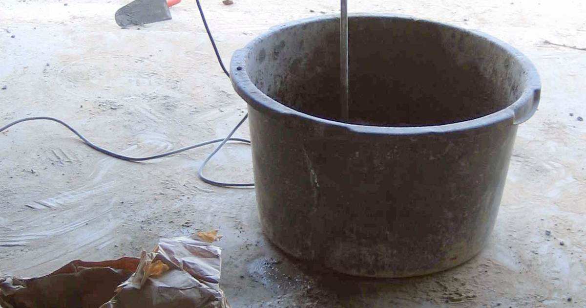 Mixing concrete in a bucket